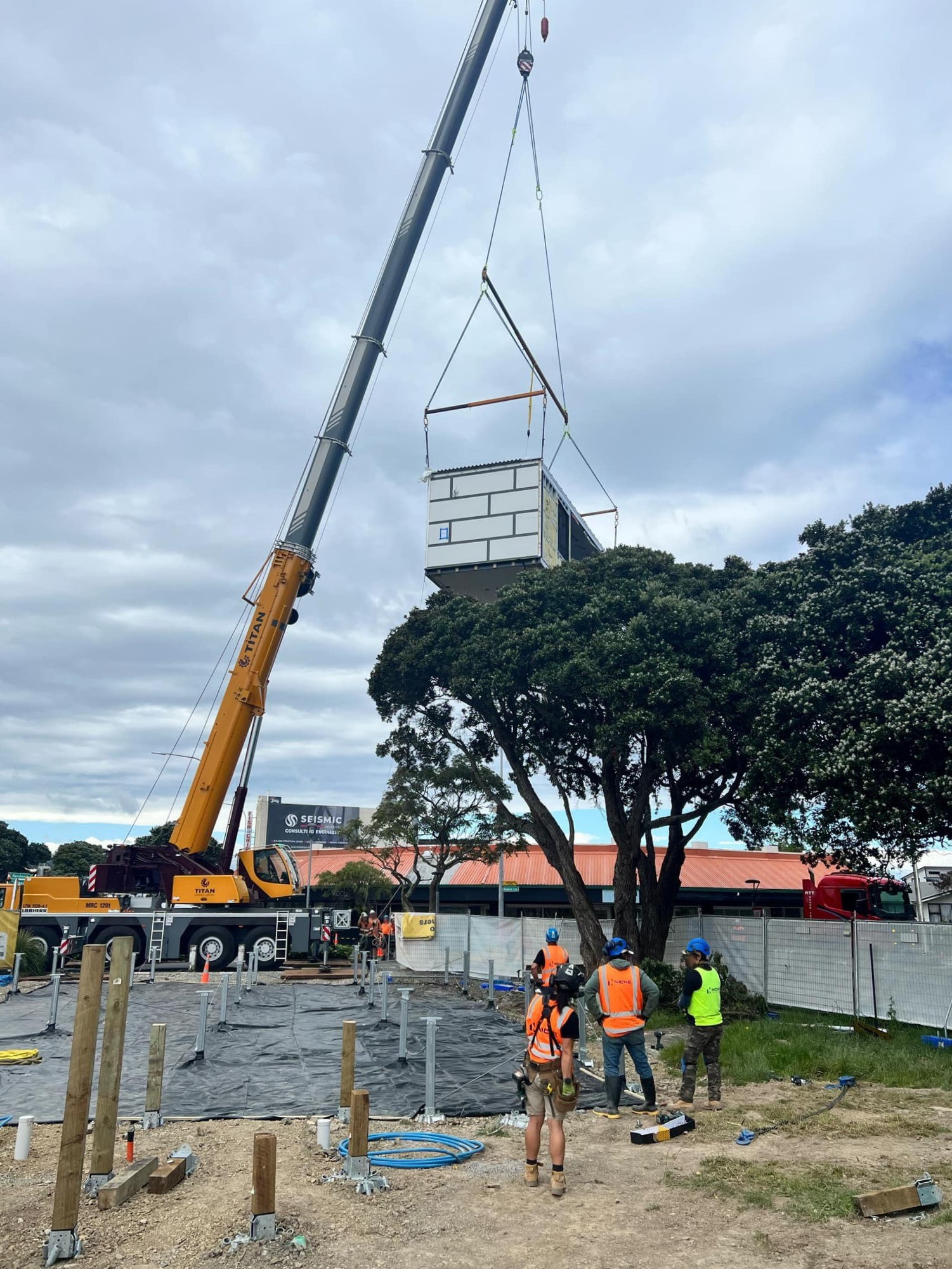 A crane lifts a section of the new Moera hub into position