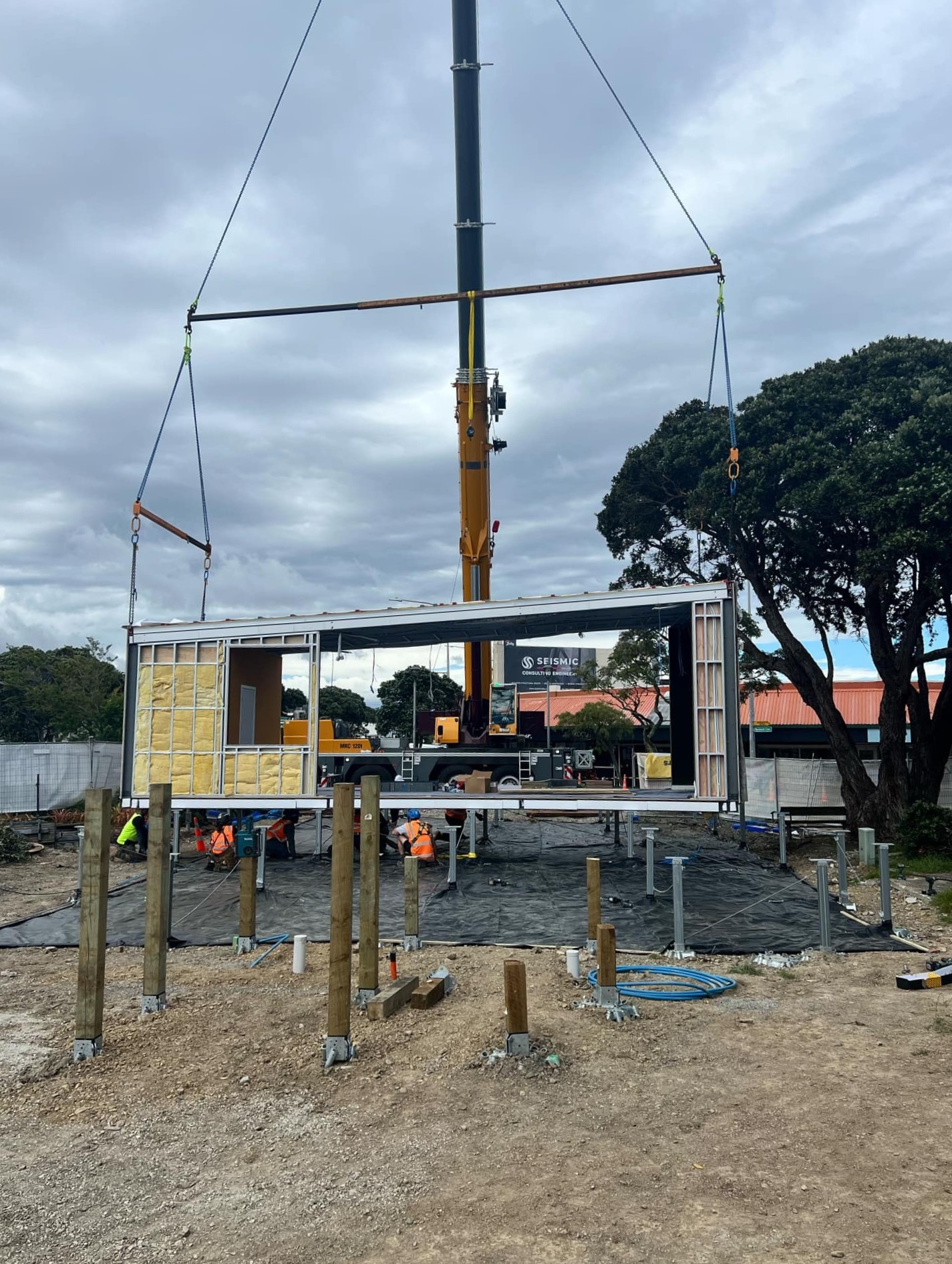 A crane lifts a section of the new Moera hub into position