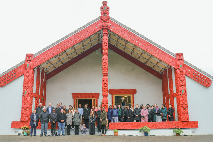 People standing in front of a marae