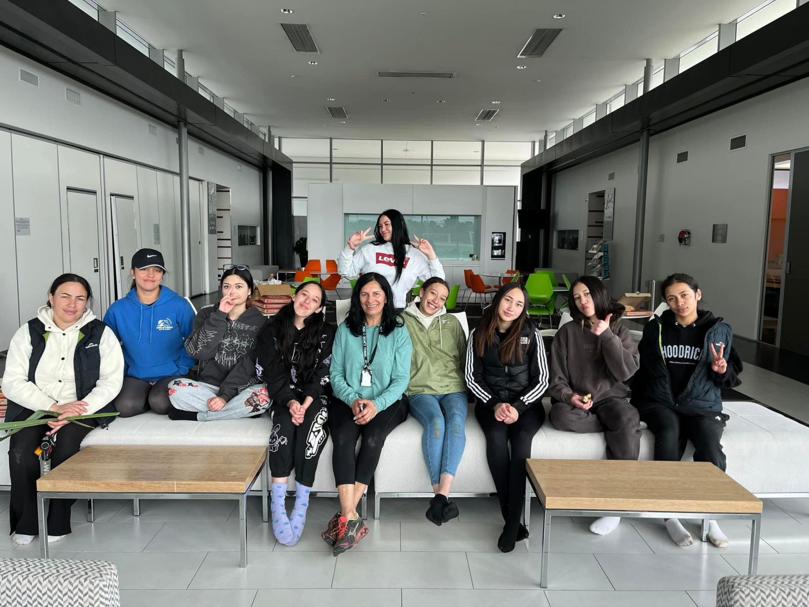 A group of 10 young women inside an office space banner image